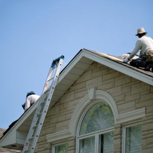Workers replacing a roof