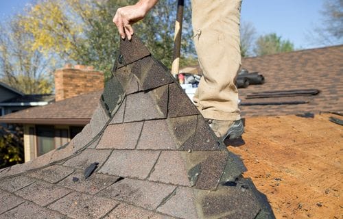 Roofing contractor replacing roof