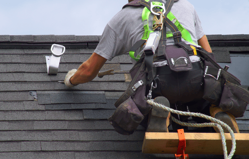 Roof installations: Worker installing roof for customer